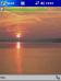 Rising sun at lake Moehne Theme for Pocket PC